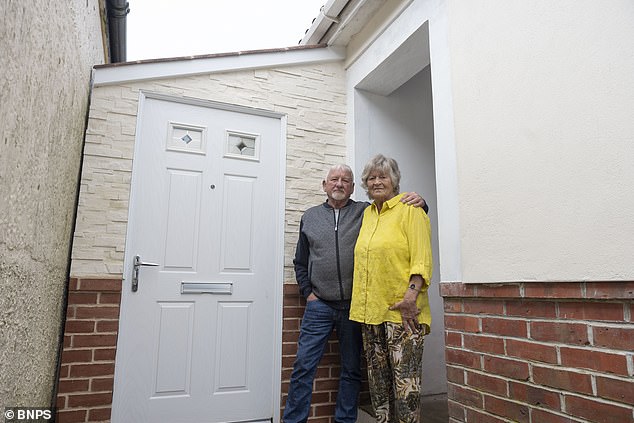 Ross Drysdale and wife Victoria in front of the extension, which the council have ordered he tear down by March 23