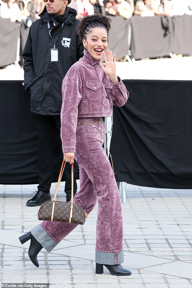 Chase Infiniti cut a trendy figure in a purple denim jacket which she wore with matching high-waisted jeans