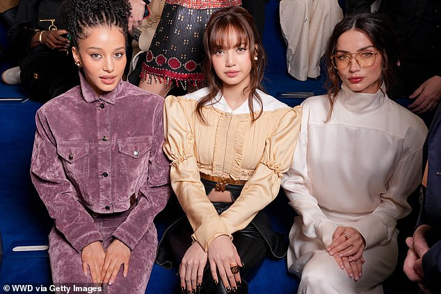 Chase (left) and Ana (right) sat in the front row at the show alongside K-pop star Lisa (centre)