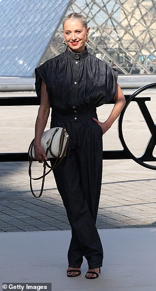 Katherine LaNasa opted for a black short-sleeved shirt and matching trousers