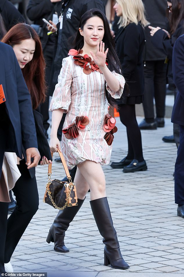 Mulan star Liu Yifei wore a pink and white patterned mini dress with a red disc embellishment