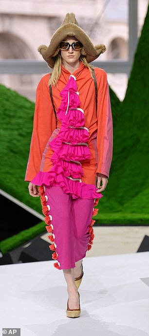 The models showcased a variety of looks on the runway including an orange and fuchsia patterned look