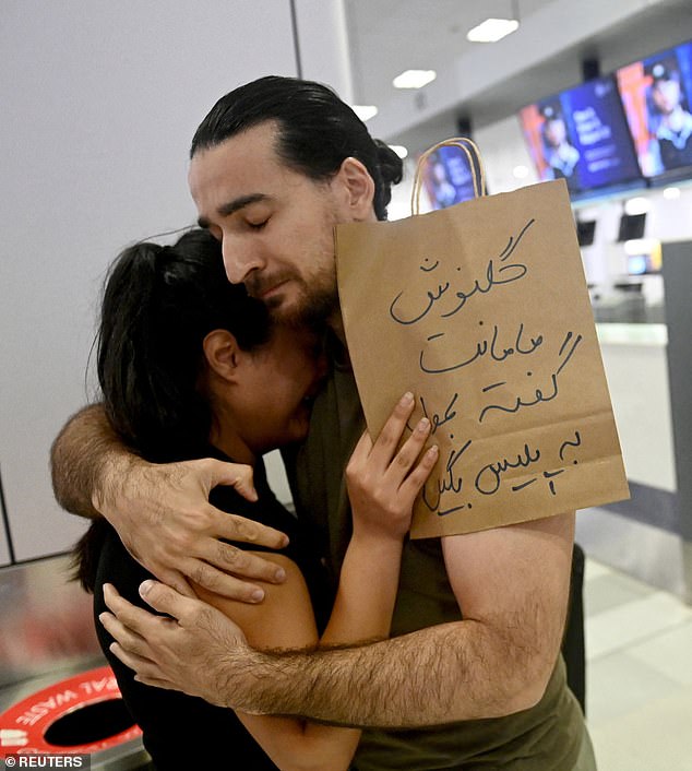 Demonstrators gathered at Sydney Airport to show their support for the women