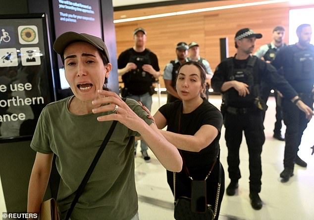 Dozens of supporters gathered at the entrance of Sydney International Airport on Tuesday night