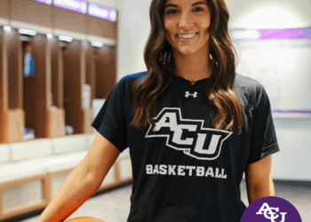 Hannah Page in Locker Room with Basketball