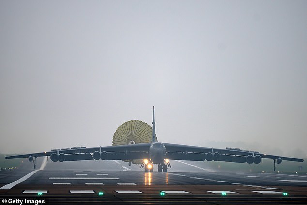 A U.S. Air Force Boeing B-52 Stratofortress bomber deploys a parachute as it lands at RAF Fairford yesterday