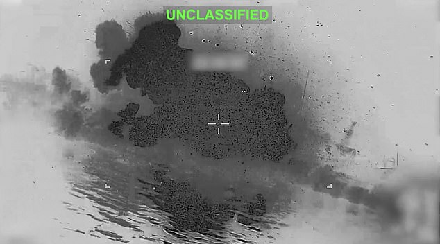 The vessel is seen being blasted to bits after being struck by a missile fired by the US
