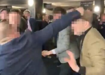 Moment Cheltenham punters brawl in bar with wild punches thrown and man's nose bust open