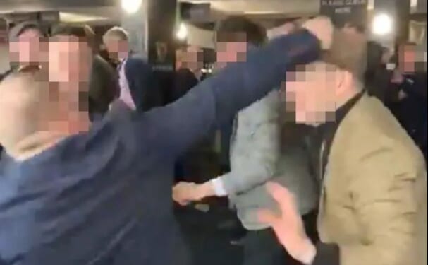 Moment Cheltenham punters brawl in bar with wild punches thrown and man's nose bust open