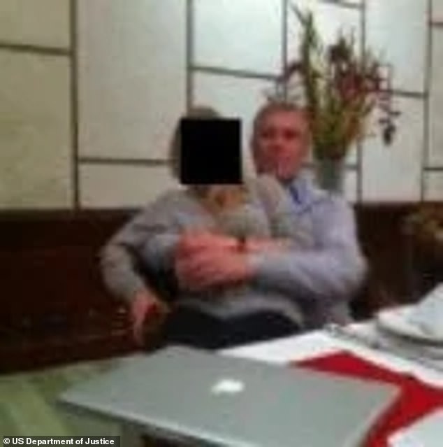 A new US Department of Justice photo of a man resembling Andrew with a woman on his lap