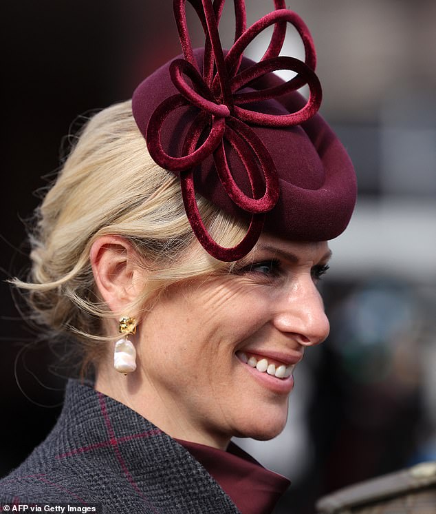A closer look at Zara's Juliette Botterill fascinator and mother-of-pearl earrings on Ladies Day at Cheltenham
