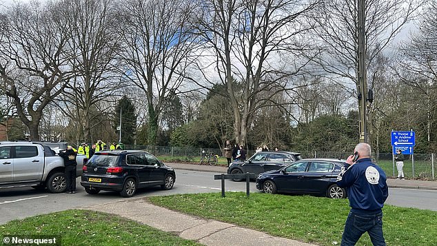 Teachers used items such as cabinets and tables to barricade classroom doors, as the school was under lockdown for almost three hours. Pictured: Police on the scene at Thorpe St Andrew School