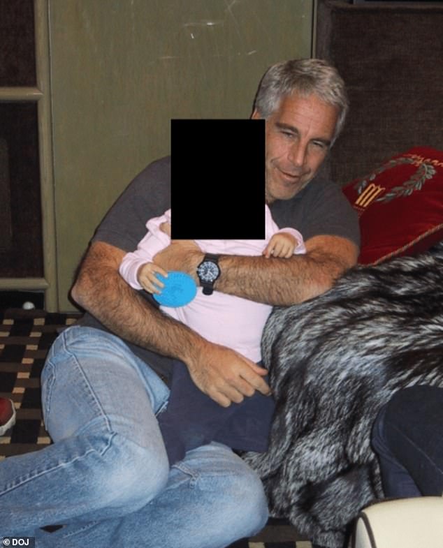 A second photo included in the files shows Epstein holding a baby in his arms, though it is unclear if it is the same child