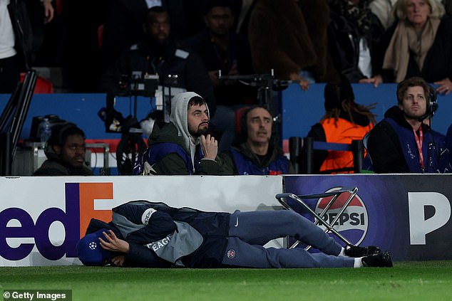 Following the shove, the ball boy was left writhing around on the floor in agony