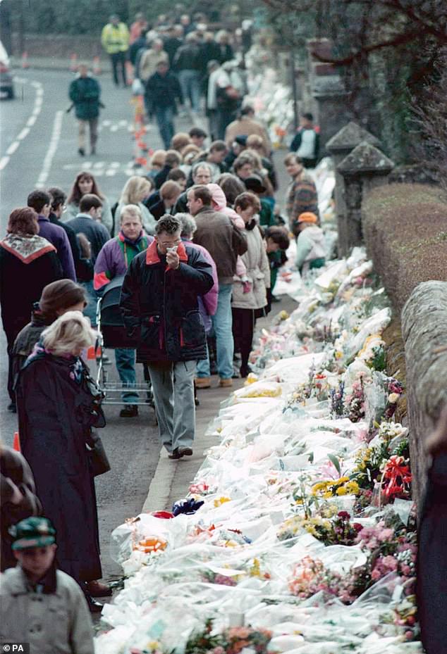 Floral tributes lining the road by Dunblane Primary School three days after the shooting in 1996