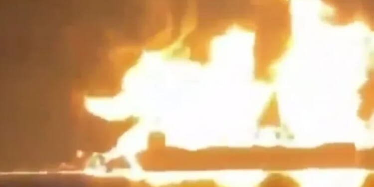 Moment huge explosions tear through oil tankers after Iran's bomb boats hit ships as crews scramble to escape inferno