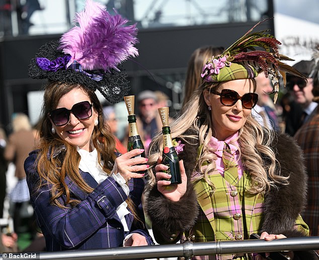 We are the Champ-ions: Revellers were seen in high spirits as they partied just metres away from celebrities and royal guests