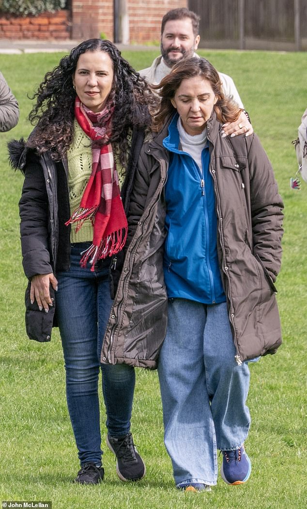 Vitoria's friend Liliane Silva (left) put a comforting arm around Ms Figueiredo Barreto's mother, Gleyz Bezerra Figueiredo Barreto (right) as they spoke to the media on Tuesday. Ms Figueiredo Barreto's boyfriend Janilson Gomes Da Silveira Filho walks behind them