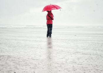 Heavy rain and 70mph winds batter UK causing travel chaos today as Met Office issues yellow warnings – before snow hits