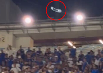 Shocking moment fan hurls CHAIR at rivals as tempers boil over in top-flight clash