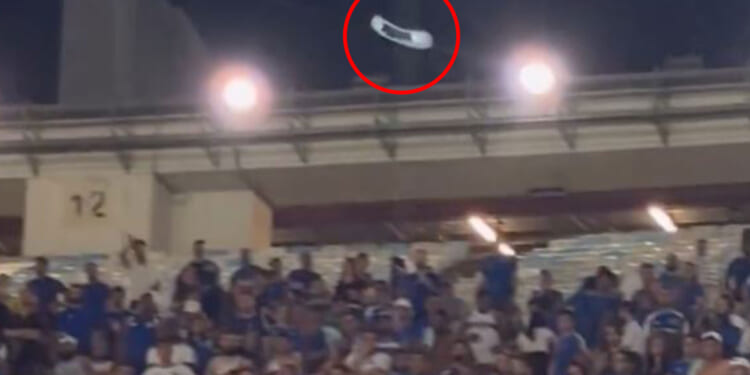 Shocking moment fan hurls CHAIR at rivals as tempers boil over in top-flight clash