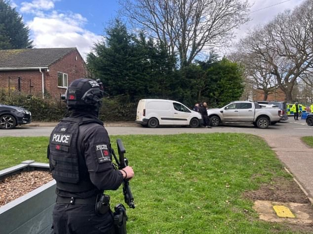 Armed police race to the scene of the stabbing in Norwich today at around 10.24am