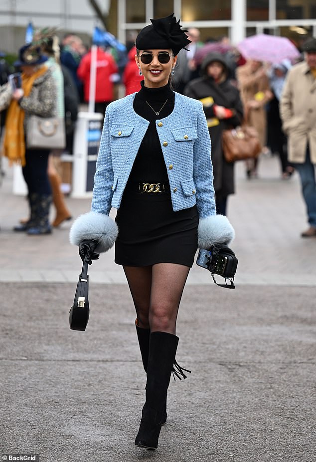 Dressed to impress: A woman showcases her fashionable look as she poses up a storm
