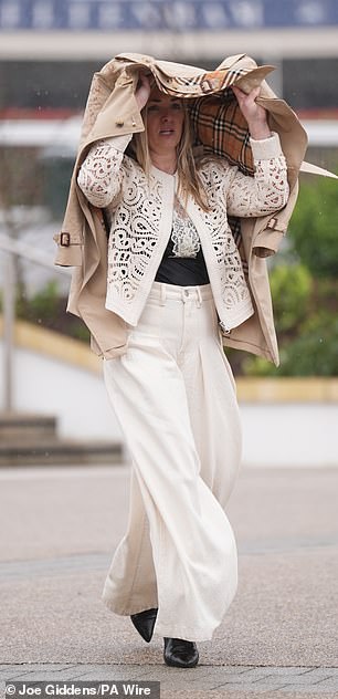 Some guests opted to use their coats to shield themselves from the rain