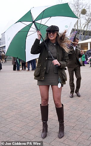 Looking good: A racegoer poses in her fashionable attire