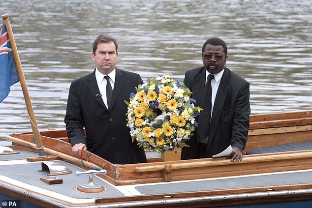 Detective Inspector Will O'Reilly and John Azah lay a wreath on the Thames for Adam in 2002