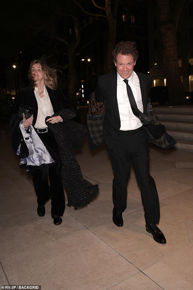 Dominic and Catherine appeared to be caught in the wind as they battled the weather