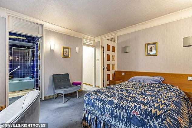 One of the six bedrooms boasts a blue colourway theme which was very much in fashion at the time