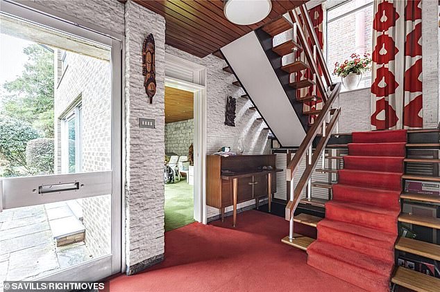 Stepping in through the front door the 1960s styles are immediately obvious from the mahogany wood-clad ceiling in the hallway and well maintained period staircase