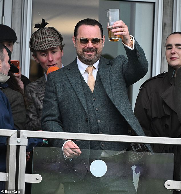 Danny Dyer raises a glass as he attends day three of Cheltenham on Thursday