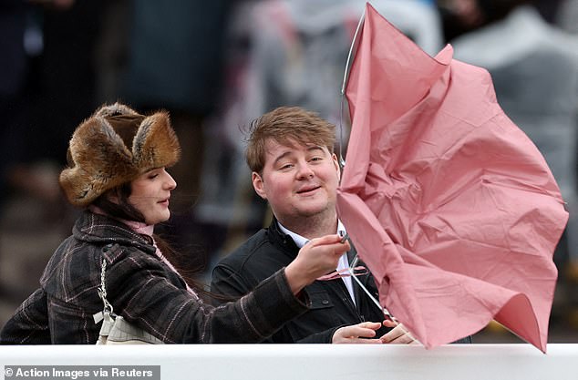 The windy weather at Cheltenham Festival today proved to be too much for some racegoers who struggled to control their brollies