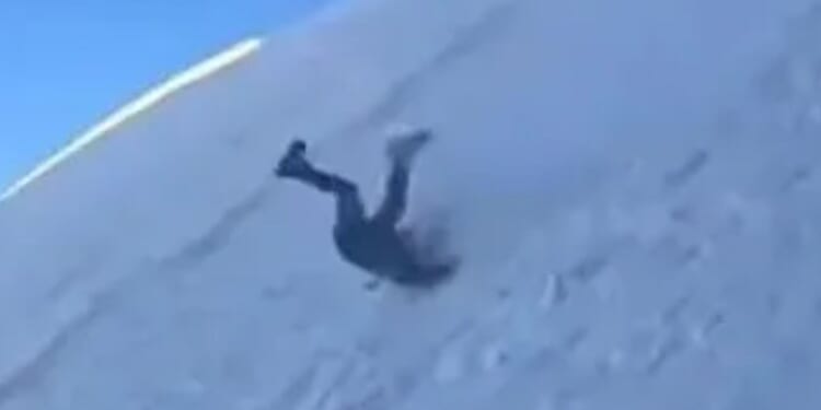 Terrifying moment mountaineer slips and uncontrollably hurtles down snowy mountain as onlookers scream in terror