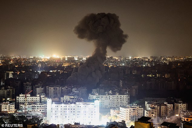 A plume of smoke covers the city skyline following reported Israeli strikes in the southern suburbs of Beirut, after an escalation between Hezbollah and Israel, amid the U.S.-Israeli conflict with Iran, Lebanon, March 13, 2026