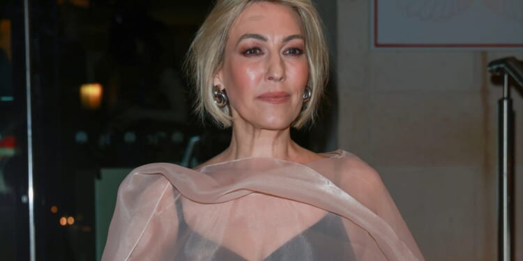 Kelly Cates stuns in bold outfit as BBC Match of the Day host puts on leggy display in Premier League stadium shoot