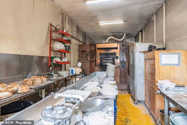 Pictured: Inside the wood-fired bakery next to the mill, where new owner could whip up a few loaves
