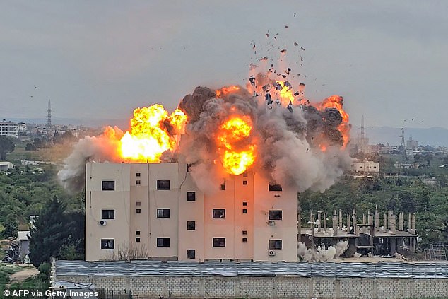 A fireball errupts from the site of an Israeli airstrike that targeted a building in the southern Lebanese village of Abbasiyyeh on March 13