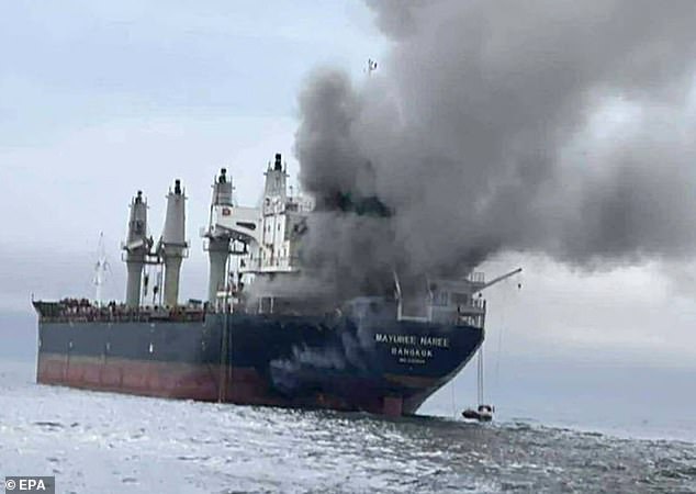 handout photo made available by the Royal Thai Navy shows the Thai-flagged cargo ship Mayuree Naree on fire after being hit by Iranian missiles in the Strait of Hormuz, Iran, 11 March