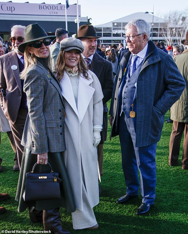 The retired football manager, 84, cut a smart figure in a grey three-piece suit as he hugged and chatted away to Geri and Christian