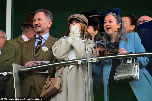 Geri, 53, looked incredible in her signature white ensemble, as she slipped into a long coat layered over matching trousers and a jumper