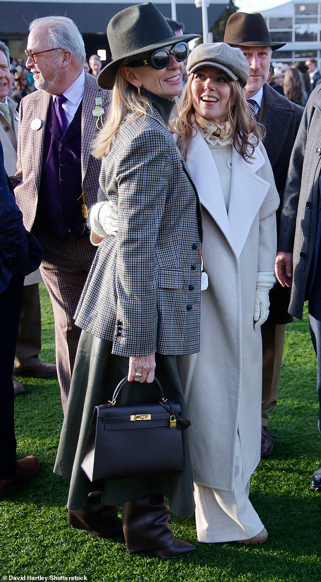 The Spice Girl was all smiles as she posed for photos with a friend