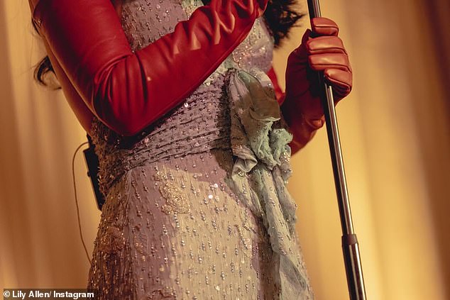 The singer paired her look with a brown leather jacket with a shearling collar and also sported red leather gloves