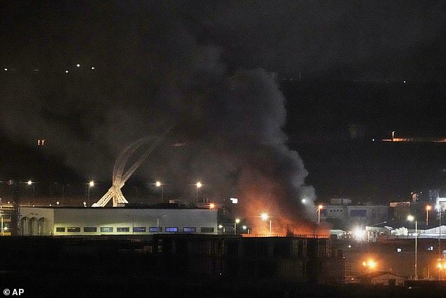 Italian soldiers were targeted by an overnight airstrike which hit the Camp Singara airbase in Erbil, Iraqi Kurdistan. (Pictured: Smoke rising after an explosion at the airport in Erbil)