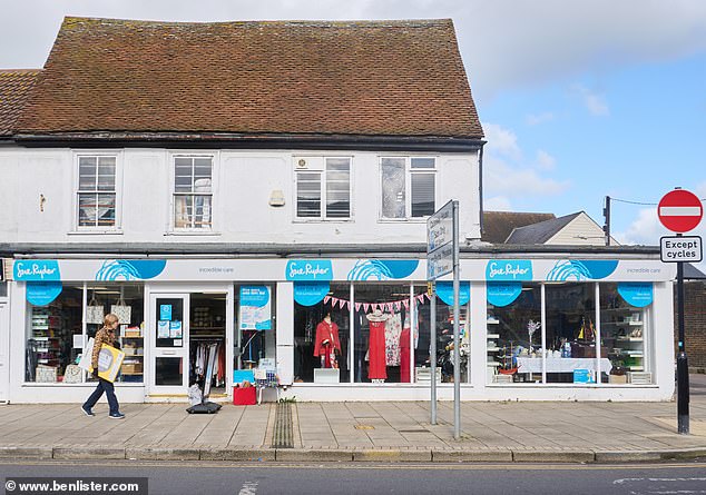 The three-person rule at the Sue Ryder shop was brought in on the police's advice, the Daily Mail was told, after the store was targeted by groups of asylum seekers