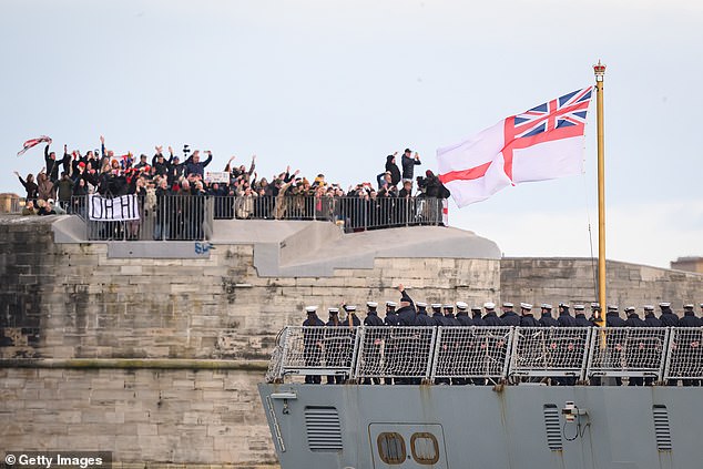 Family and friends wave goodbye to their crewmembers as HMS Dragon finally sets sail