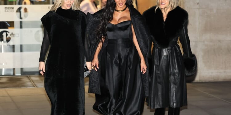 Pussycat Dolls trio put on a united front for first TV appearance as bitter feud rumbles on after reunion announcement