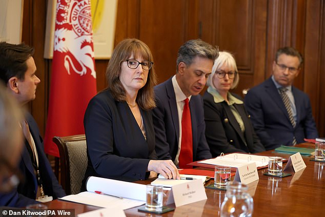 Treasury officials are said to be working on a package aimed at poorer households amid a doubling of prices to around 130 pence per litre in some areas since the start of the Iran War. Pictured: Ms Reeves (centre) and Energy Security and Net Zero Secretary Ed Miliband (third right)